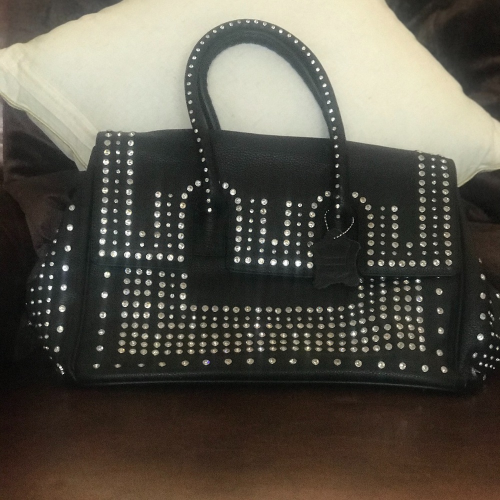 Leather Charm and Luck satchel by Jenny Syquia